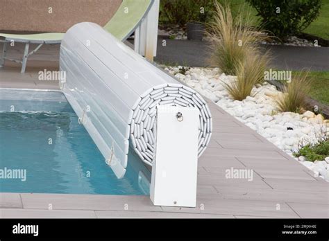 Rigid Pool Cover On Edge Of Swimming Pool Stock Photo Alamy