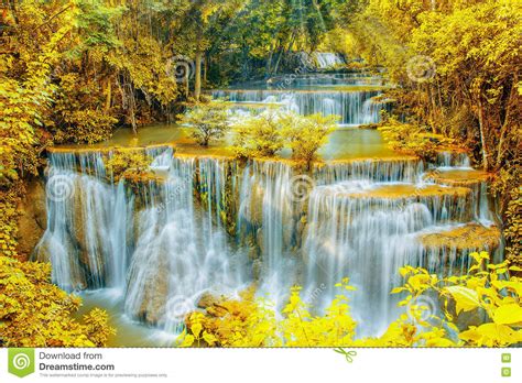 Beautiful Waterfall In Autumn Forest With Ray Light Stock Photo