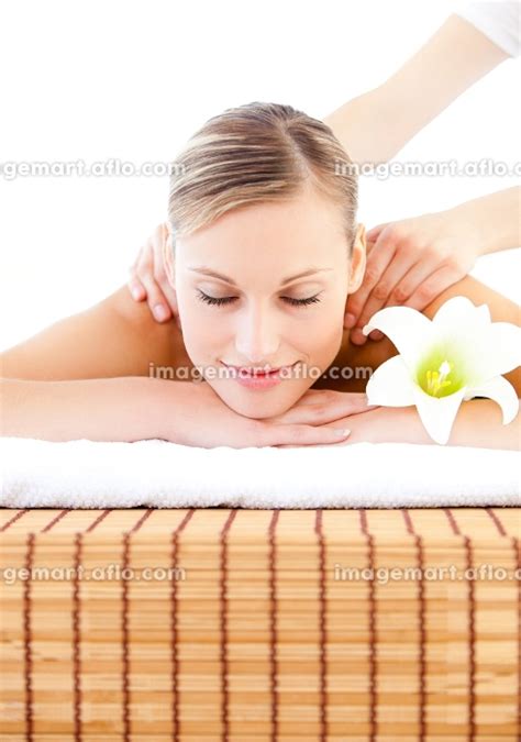 Portrait Of An Attractive Young Woman Receiving A Massage In A Spa