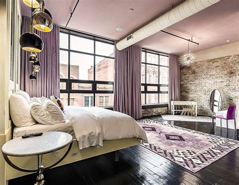 Sliding steel door provides privacy for the master bedroom in the open floor plan. Urban Loft - PALOFTS