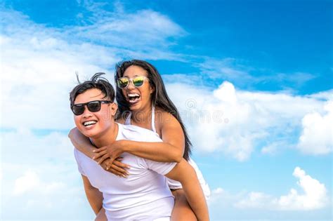 Asian Couple Having Fun On The Beach Of Tropical Bali Island Indonesia Stock Image Image Of