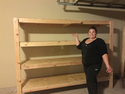 They're the perfect size for those giant plastic bins, and are great for storing camping gear and christmas. Very easy garage shelving | Ana White