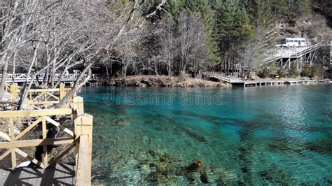 Lake With Clear Crisp Water Surrounded With Mountaineous Scenery Stock