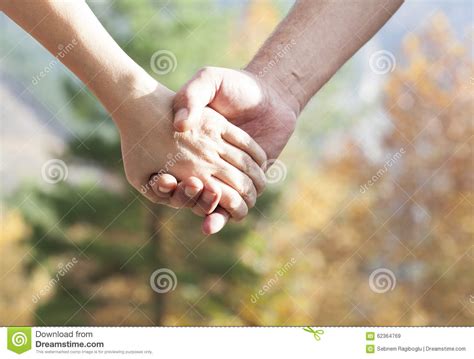 Couple Walking In The Autumn Park Holding Hands Stock Image Image Of