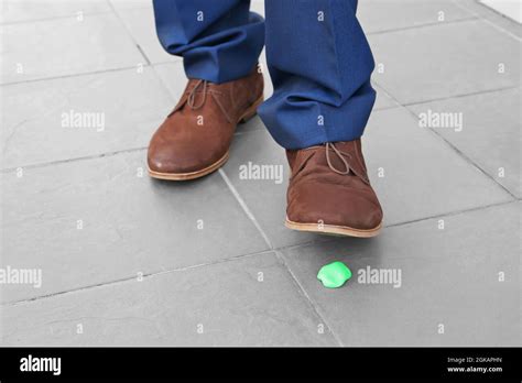 Man And Chewing Gum On Sidewalk Concept Of Stickiness Stock Photo Alamy