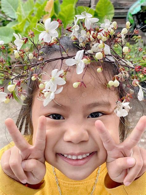 Adorable Child Asian Woman Smiling With Flower Crown On Head Happy