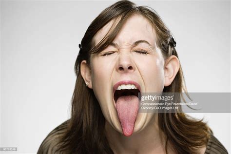 Young Woman Sticking Her Tongue Out 圖庫照片 Getty Images