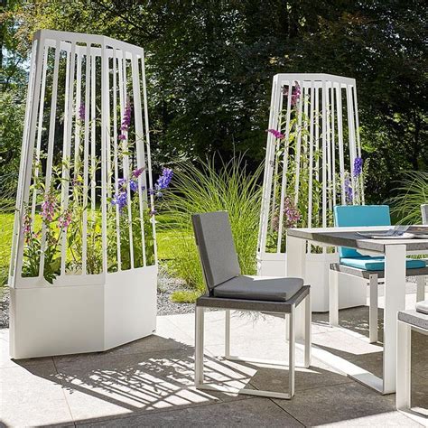 Made of wood and rolling iron wheels, this planter provides robust construction and durable quality for facing outside. AIR Trellis PLANTER Is A MODERN Plant SCREEN With WHEELS ...