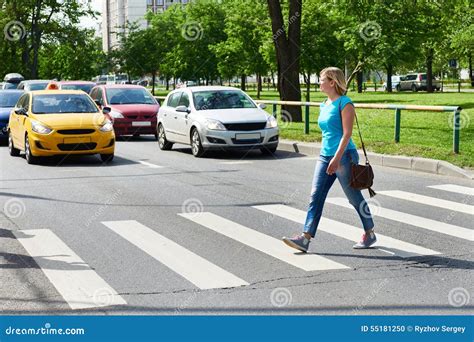 Woman Crossing Street At Pedestrian Crossing Stock Photo Image Of