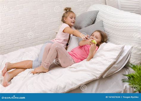 Two Little Kids Girls Play In The Bedroom Stock Photo Image Of Child