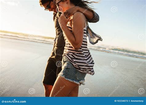 Couple Strolling Together On Beach On A Summer Day Stock Image Image