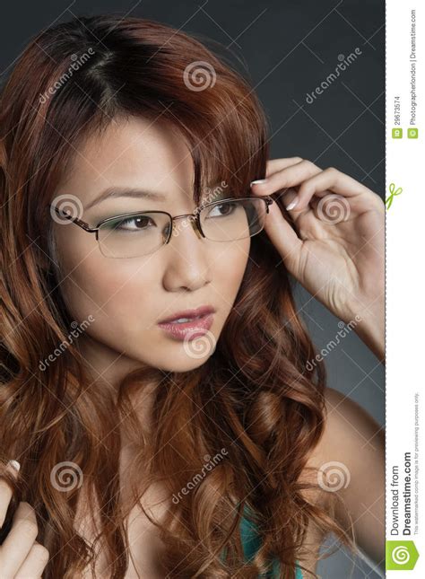 Beautiful Chinese Woman Wearing Glasses Over Colored Background Stock