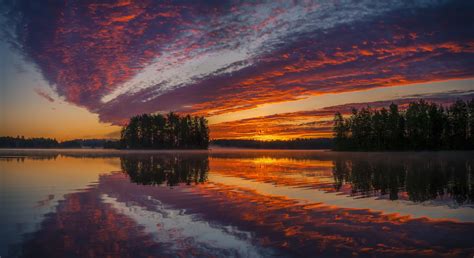 Beautiful orange sky at sunset reflected in water wallpapers and images ...