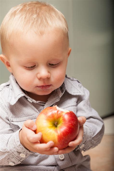 Little Boy Child Kid Eating Apple Fruit At Home Stock Photo Image Of