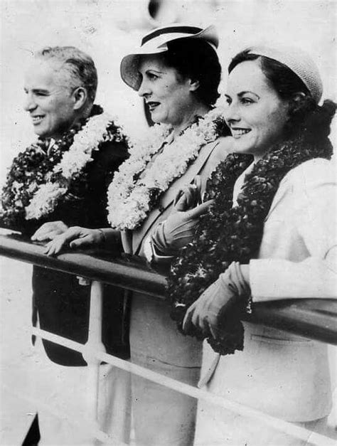an old photo of three women sitting next to each other on a boat with flowers in their hair
