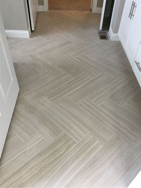 Santino Bianco 6x24 Tiles In Herringbone Pattern On Floor Of Bathroom