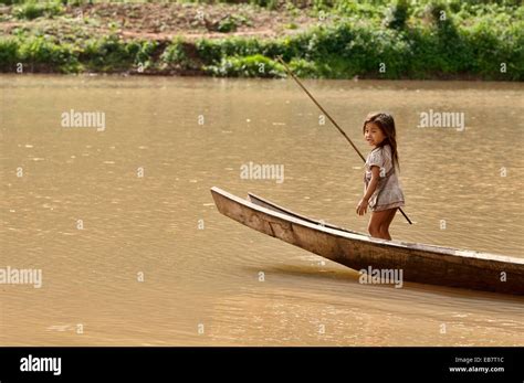 Lanten Girl In Her Dugout Canoe On The Nam Ha River Luang Nam Tha Laos Stock Photo Alamy