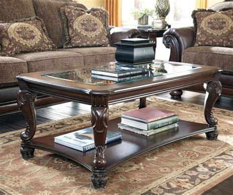 A large table hides a smaller table these benches are typically utilized as seating at dining room tables, but they work well as coffee tables to provide lots of surface space. Signature Design By Ashley Norcastle Rectangular Coffee ...