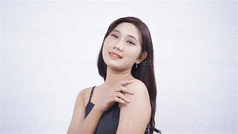 Asian Beauty Shows Her Make Up From The Side Isolated On White