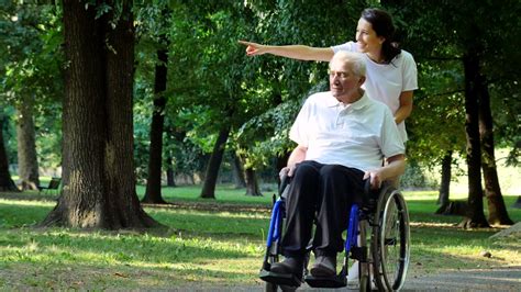 Caregiver With Patient In The Park Hd Youtube