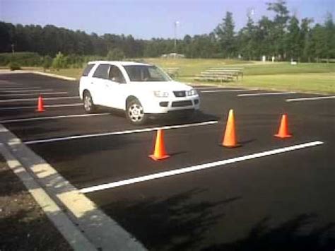 Place one cone in front of the car and two behind. how to parallel park - YouTube
