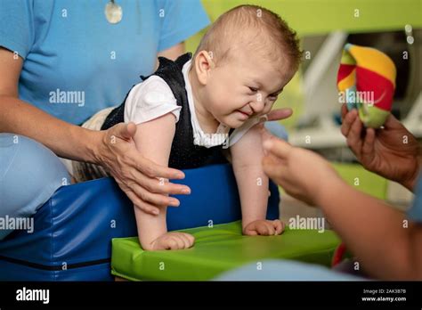 Portrait Of A Baby With Cerebral Palsy On Physiotherapy In Children