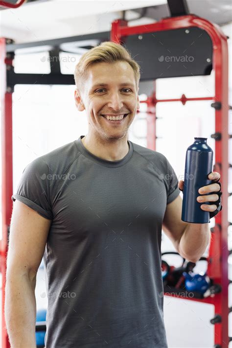 Man Drinking Water Break During Gym Workout Stock Photo By Diignat