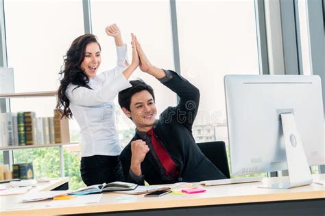 Two Happy Business People Celebrate At Office Stock Photo Image Of