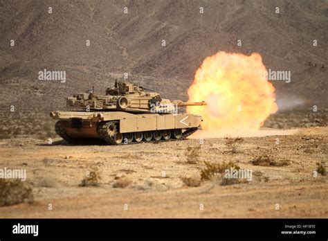 An M1a1 Main Battle Tank Manned By Australian Army Soldiers Engage A