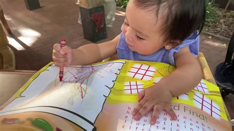 Baby Scribbles With Crayon While Waiting For Our Food Order In The