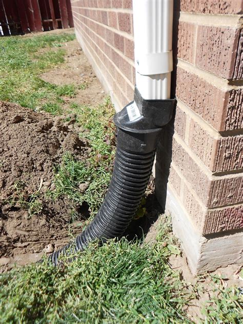 How To Bury A Gutter Downspout Backyard Landscaping Yard Drainage Yard Landscaping