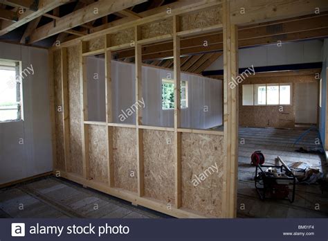 If you're building a stud wall in a garage or basement, you'll use metal tracks to attach the studs to. Dividing stud wall in timber frame building Kettering UK ...