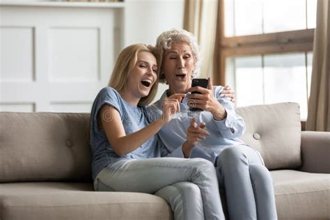 Overjoyed Adult Son And Mature Mother Hugging Having Fun Stock Image Image Of Couch Cuddle