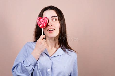 Cute Woman Having Fun With Heart Shaped Lollipop Stock Photo Image Of