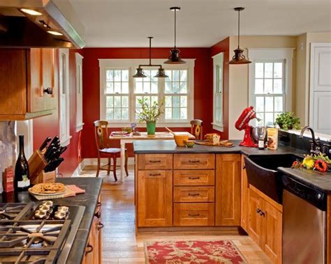 This kitchen intelligently creates different zones using blocks of white and dark cabinets at opposite ends of the kitchen. Image result for brown kitchen red wall | Red kitchen ...