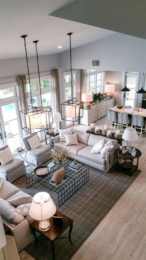 A Living Room Filled With Furniture And Lots Of Windows