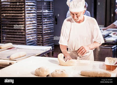 Making Bread Senior Baker Kneading Dough Stock Photo Alamy