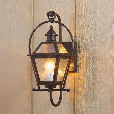 An Outdoor Wall Light On The Side Of A House