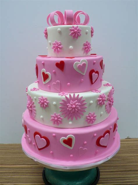 A quality trusted medium company offering electronic and social media services in full range to families, individuals & businesses. pink and white flowers hearts wedding cake | Valentine ...