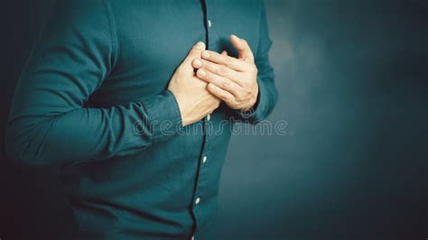 Adult Man Suffering From Chest Pain Hand Pressing On Chest With