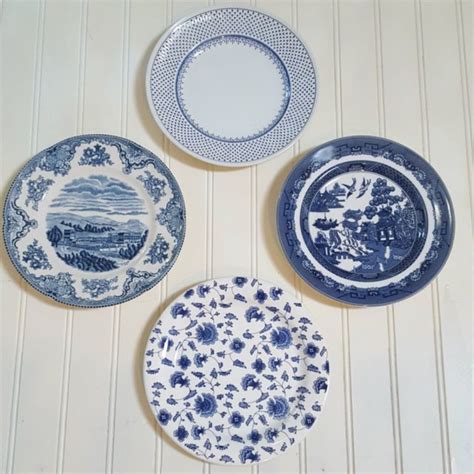 A Collection Of 4 Blue And White Plates They Are Ready To Hang Or