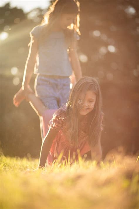 Two Little Girls Playing In Nature Stock Photo Image Of Happy