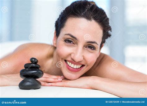 smiling brunette relaxing on massage table stock image image of care person 53072439