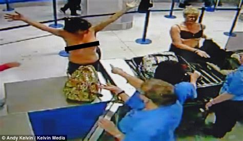 Two mums strip off in front of stunned passengers at Manchester ott板