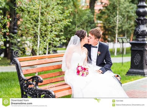 Groom Kissing Bride Outdoors Stock Image Image Of Enjoying Look