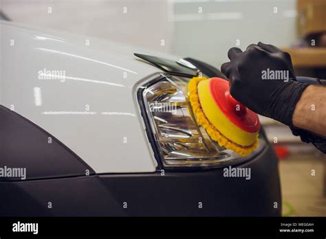 Auto Mechanic Buffing And Polishing Car Headlight Car Detailing Man