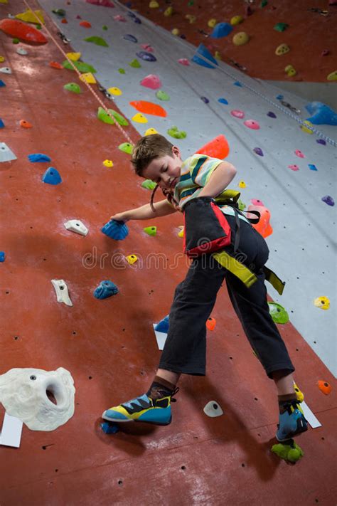Boy Practicing Rock Climbing In Fitness Studio Stock Image Image Of