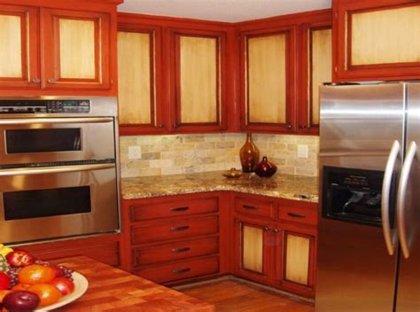 For example, a modern cabinet scheme in a dark brown contrasts beautifully with stainless steel cabinets, either in their familiar steel shade or in shades of red or deep blue. Two Tone Kitchen Cabinet with Lovely Design Ideas