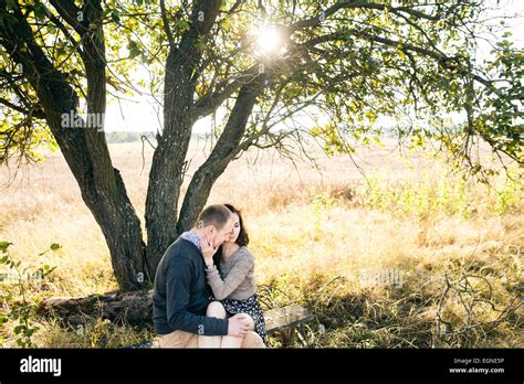 Couple Sitting Under Tree Hi Res Stock Photography And Images Alamy