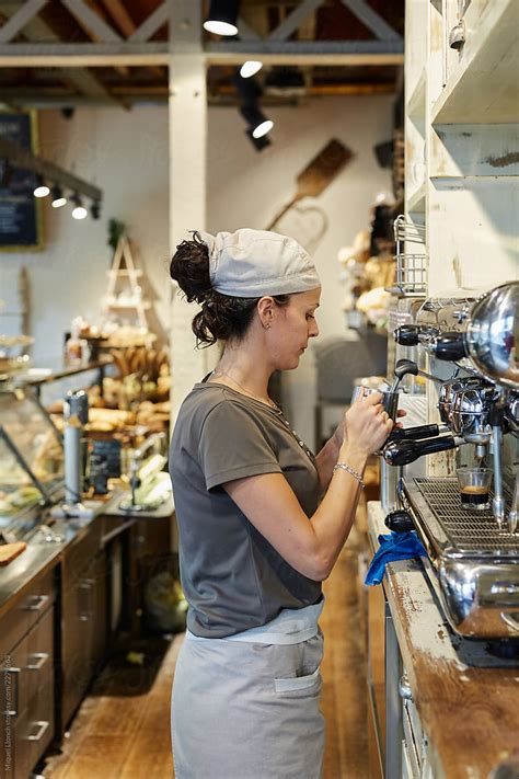 Waitress Making Coffee In A Bakery Del Colaborador De Stocksy Miquel